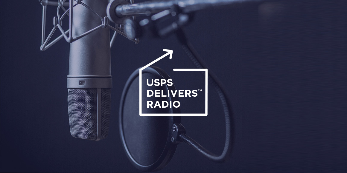 A professional microphone with the logo for "USPS Delivers Radio."