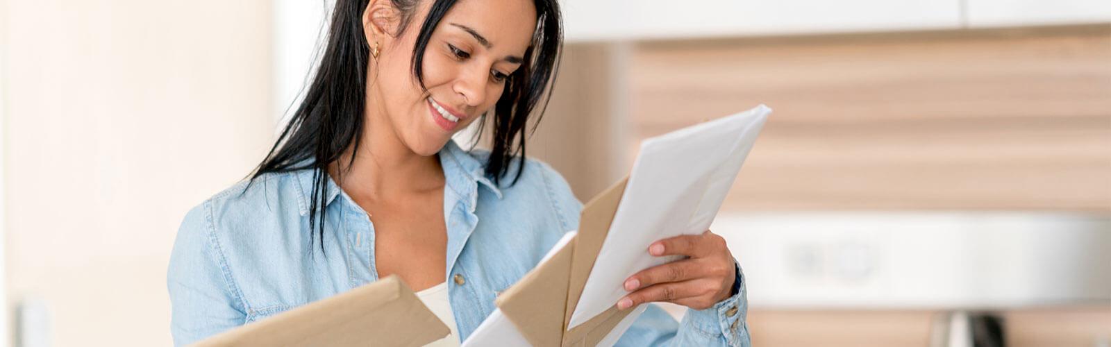 A woman shuffling through her mail.