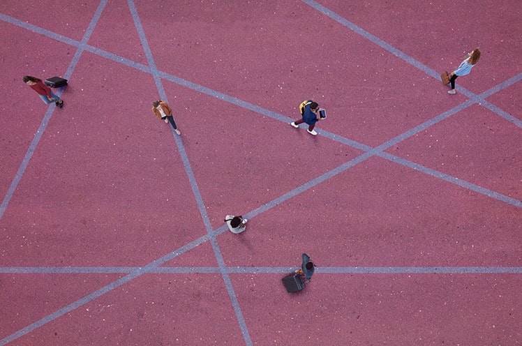 Illustration showing an aerial view of people connecting by various lines.