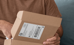 A person opening a package.