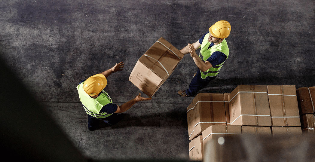 Top-down view of a crew working in a high-volume shipping environment