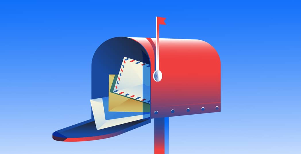 Open mailbox with the red flag raised and multiple mailpieces flowing out the front.